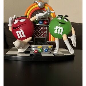 ICONIC M & M CANDY DISPENSER RED AND GREEN CHARACTERS DANCING WITH JUTE BOX